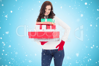 Composite image of pretty brunette posing and holding pile of gi