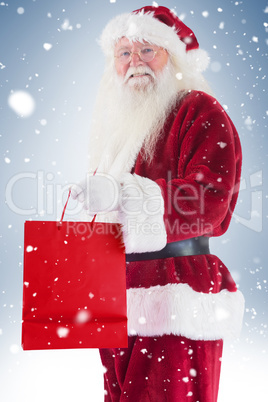 Santa carries red gift bag