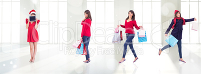 Composite image of festive brunette holding gift bags