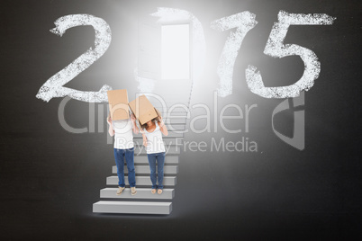 Composite image of mature couple wearing boxes over their heads