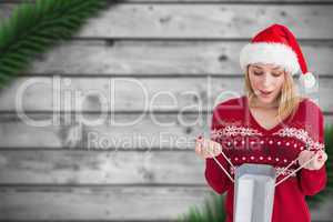 Composite image of woman looking in bag