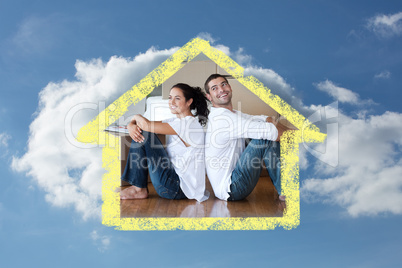 Composite image of radiant couple with unpacking boxes moving to