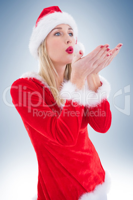 Festive blonde blowing over hands