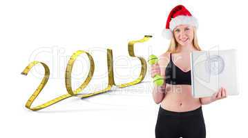 Composite image of festive fit blonde smiling at camera