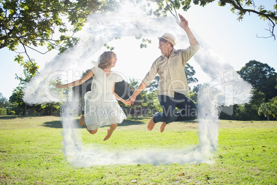 Composite image of cute couple jumping in the park together hold