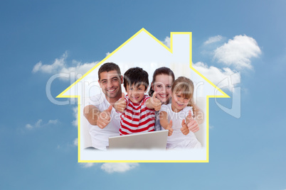 Composite image of family at home using a laptop with thumbs up