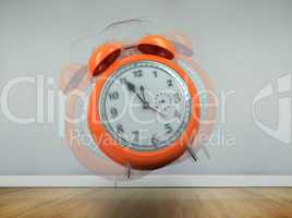 Composite image of alarm clock counting down to twelve