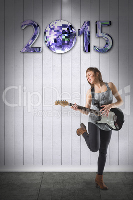 Composite image of pretty young girl playing her guitar