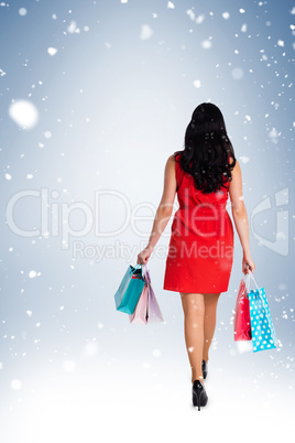 Woman standing with shopping bags