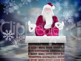 Composite image of santa claus sits and meditates