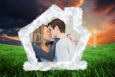 Composite image of hugging and kissing couple