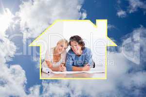 Composite image of cute couple moving in a new house