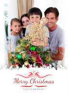 Composite image of happy family decorating a christmas tree