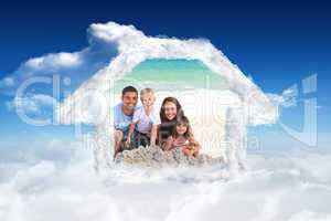 Composite image of radiant family at the beach