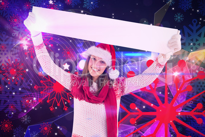 Composite image of festive woman presenting empty banner