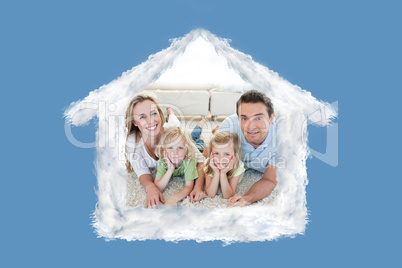 Composite image of family lying on the carpet