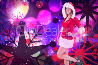 Composite image of festive brunette looking at camera