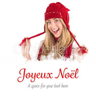 Composite image of pretty blonde smiling at camera in warm cloth