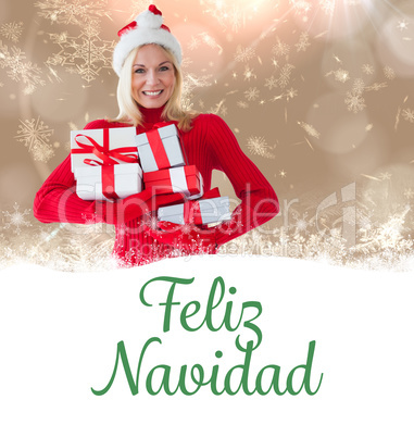 Composite image of happy festive blonde with gift