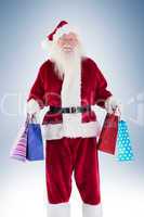Santa carries some christmas bags