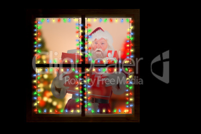 Composite image of santa carries a few presents Composite image of santa carries a few presents