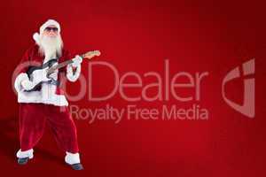 Composite image of santa claus plays guitar with sunglasses