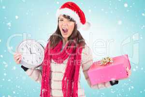 Composite image of yelling brunette holding a clock and gift