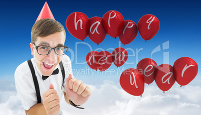 Composite image of geeky hipster in party hat