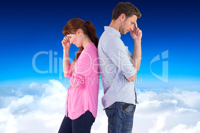 Composite image of irritated couple ignoring each other