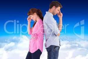 Composite image of irritated couple ignoring each other