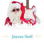 Composite image of cool santa showing electric guitar