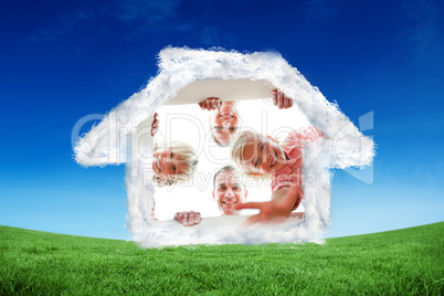 Composite image of happy family unpacking boxes Composite image of happy family unpacking boxes