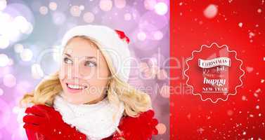 Composite image of happy festive blonde