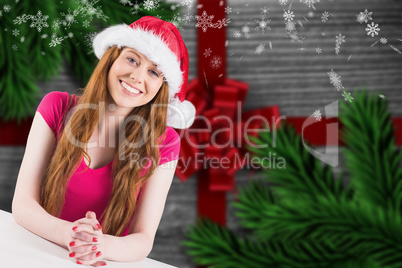 Composite image of festive redhead smiling at camera