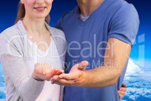 Composite image of couple holding out their hands
