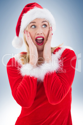 Festive blonde with hands on face