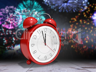 Composite image of alarm clock counting down to twelve