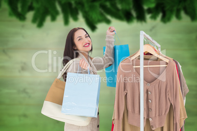 Composite image of smiling woman shopping