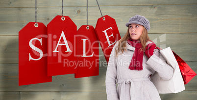 Composite image of happy blonde in winter clothes posing