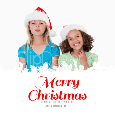 Composite image of cheerful girls with christmas hats