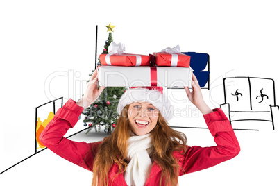 Composite image of festive redhead holding pile of gifts