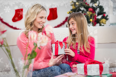 Composite image of festive mother and daughter with many gifts Composite image of festive mother and daughter with many gifts