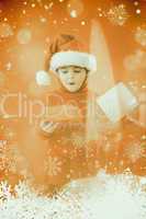 Composite image of festive little boy opening a gift