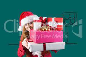 Composite image of festive redhead holding pile of gifts