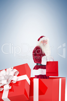 Santa standing in large gift