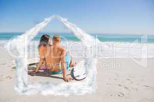 Composite image of pretty young couple with their surfboards loo