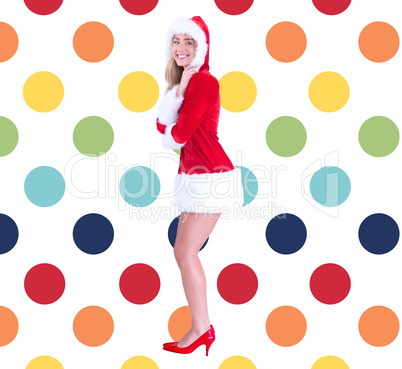 Composite image of pretty santa girl smiling at camera