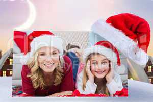 Composite image of festive little girl with mother surrounded by
