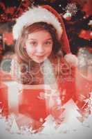 Composite image of festive little girl with gifts