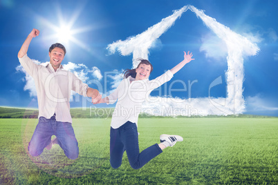 Composite image of couple jumping and holding hands